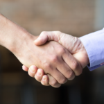 Two persons shaking hands